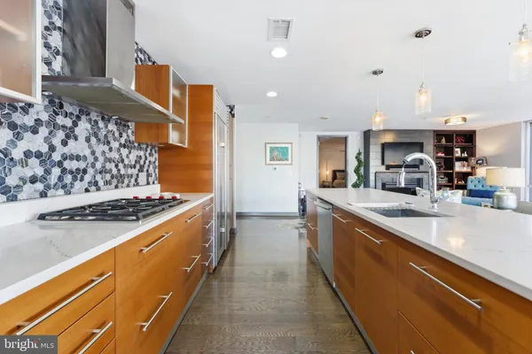 a bedroom with a bed lamp and a window