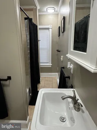 a bathroom with a sink and mirror