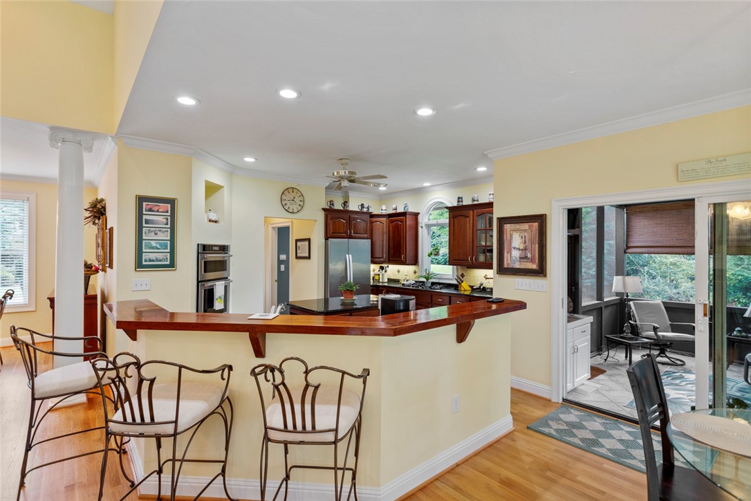 3902 Turnberry Loop Seneca, SC 29678 - Photo 16 of 45 Kitchen with bar seating, granite countertops cherry counter, and the most beautiful solid cherry cabinets you could imagine.