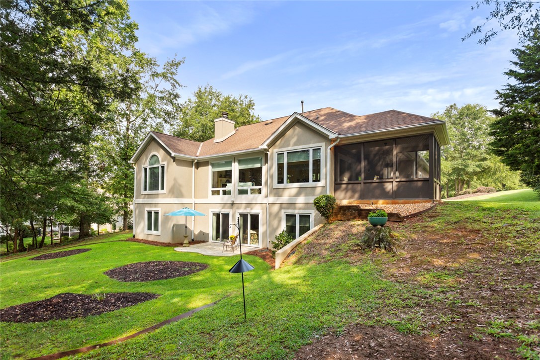 3902 Turnberry Loop Seneca, SC 29678 - Photo 5 of 45 The back of the home has its own patio and nice landscape