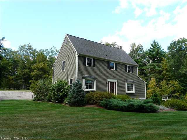 18 Washbrook Road Newtown, CT 06470 - Photo 1 of 1 a front view of a house with a garden