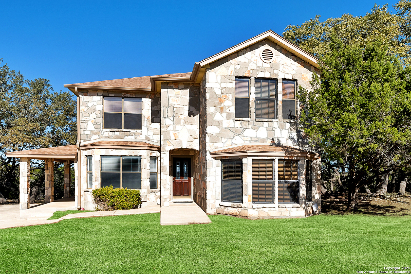 front view of a house with a yard