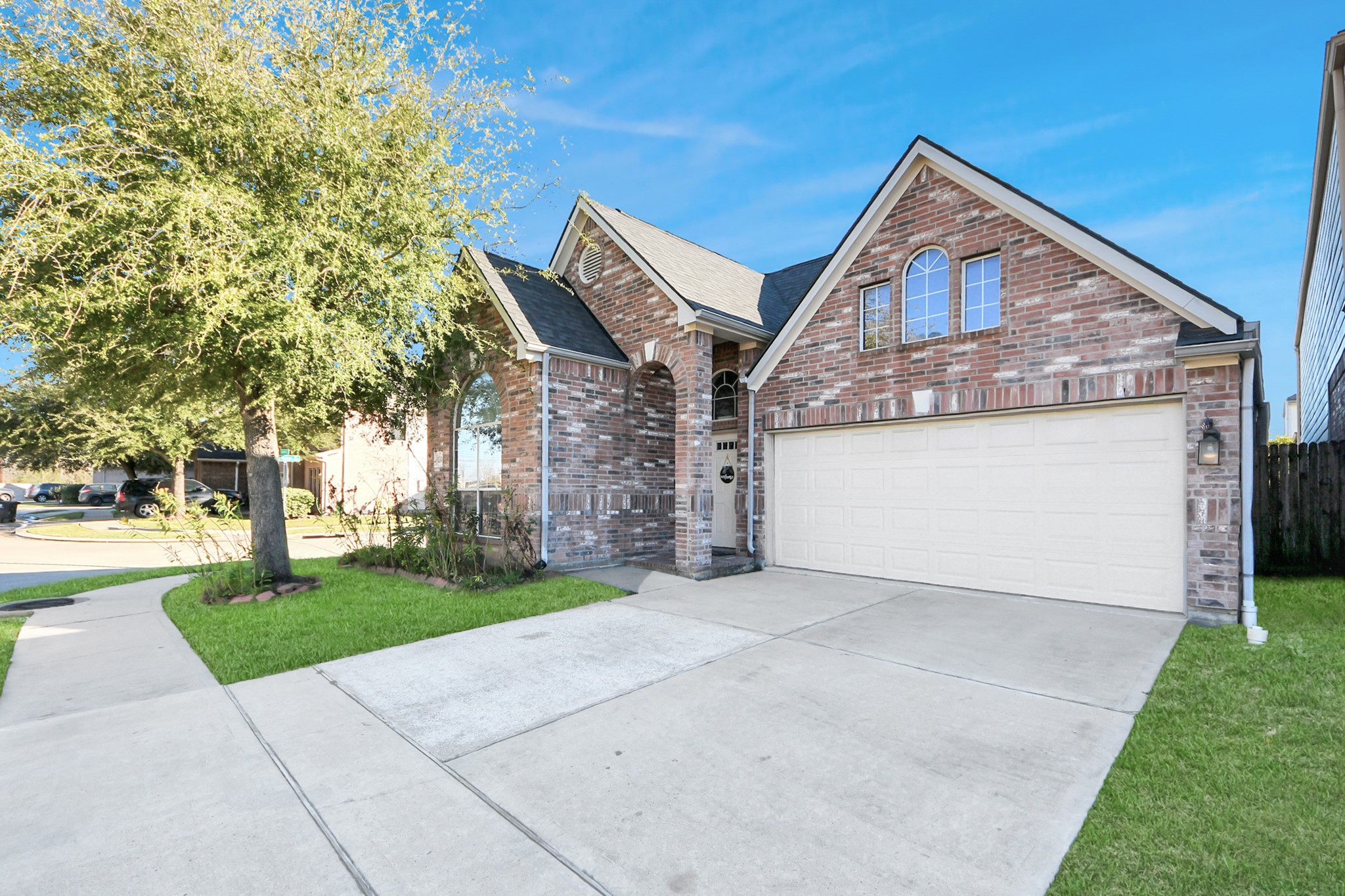 13342 South Point Lane Houston, TX 77034 - Photo 35 of 37 a front view of a house with a yard and garage
