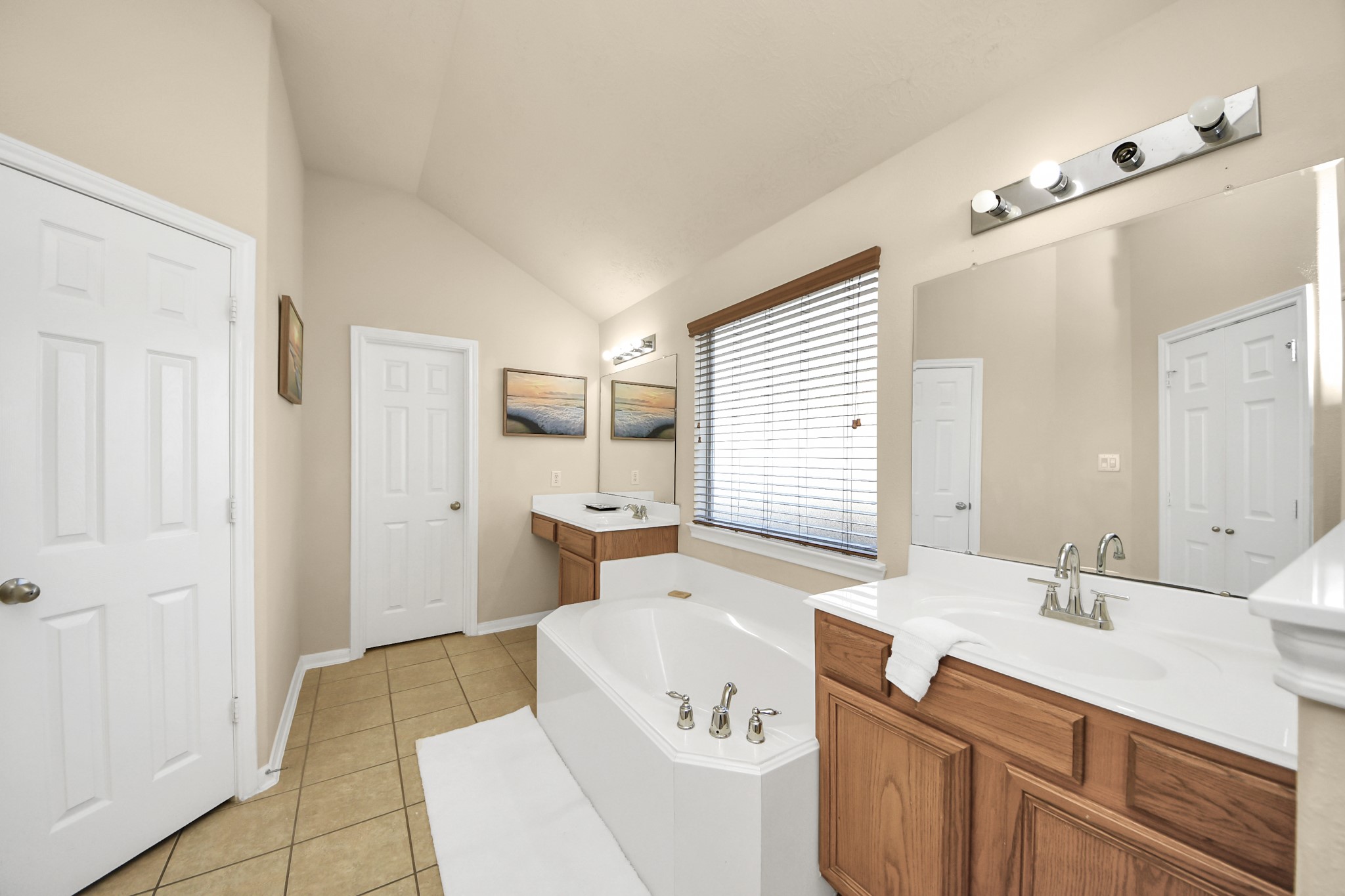 13342 South Point Lane Houston, TX 77034 - Photo 9 of 37 a spacious bathroom with a sink mirror and a bath tub