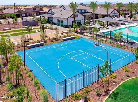 a view of a tennis ground with a large pool