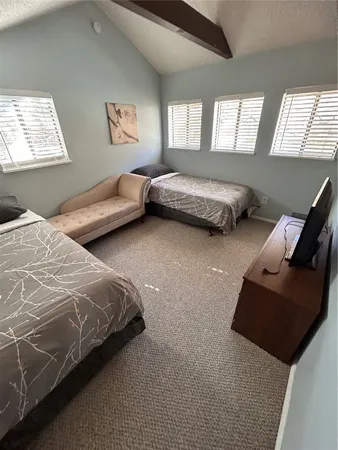 a bedroom with bed and window