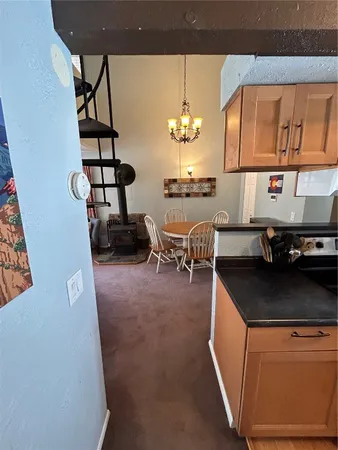 a living room with furniture and next to a window