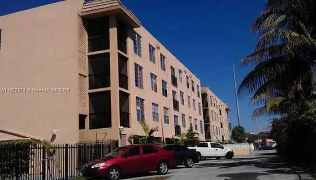 a city street lined with buildings and cars