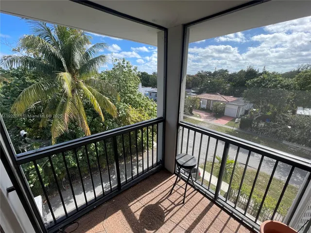 a view of balcony with wooden floor