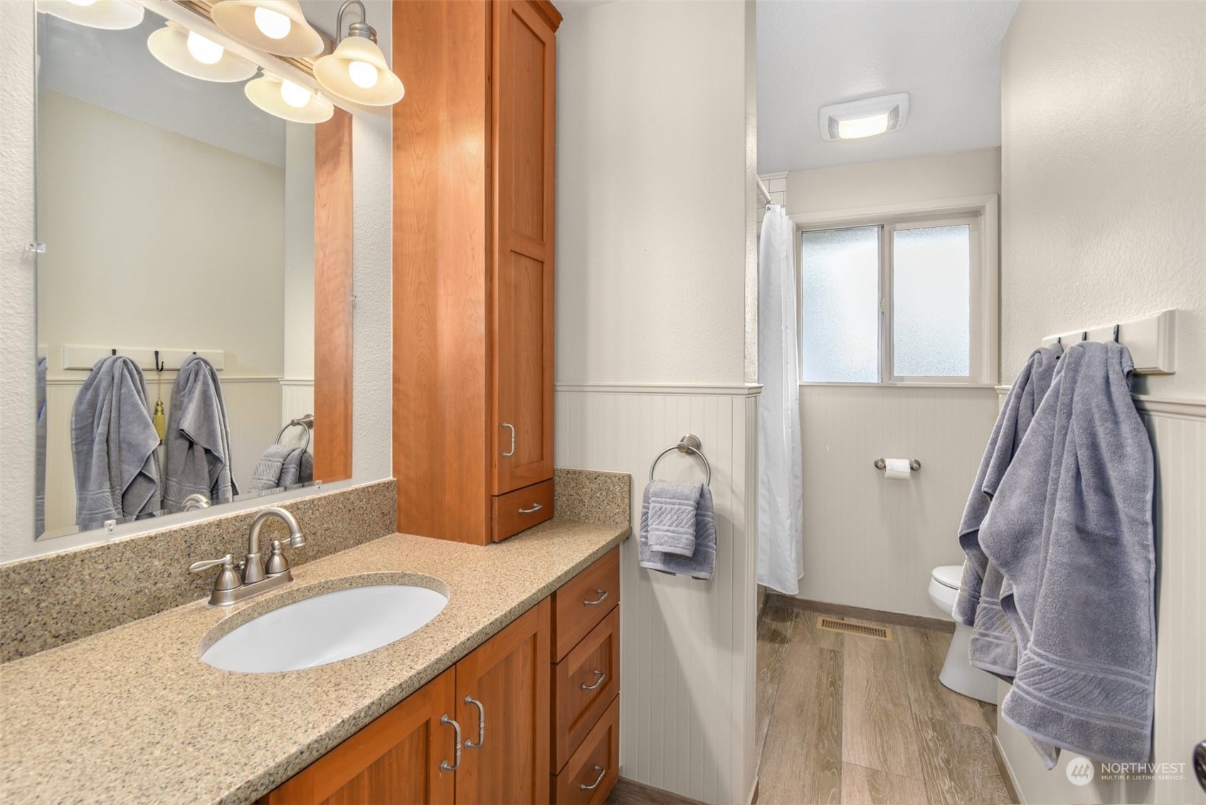 823 South 28th Court Renton, WA 98055 - Photo 11 of 37 a bathroom with a double vanity sink and a mirror