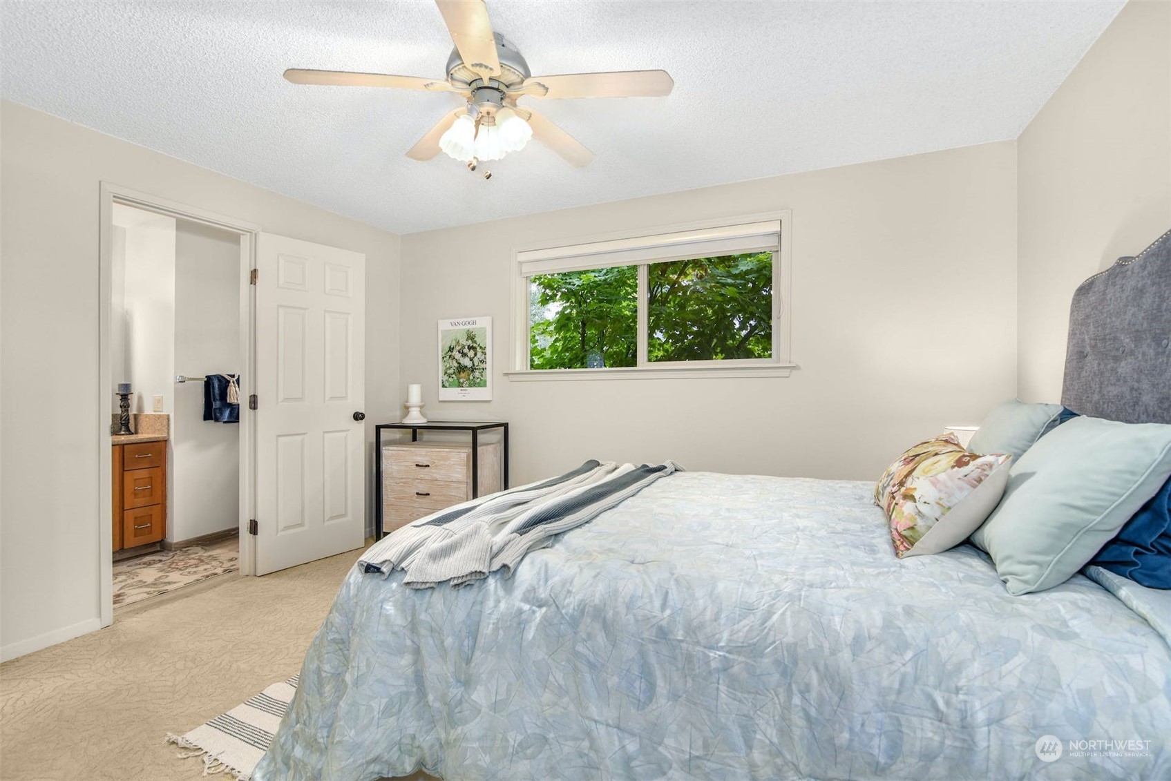 823 South 28th Court Renton, WA 98055 - Photo 15 of 37 a bedroom with a bed and a chandelier