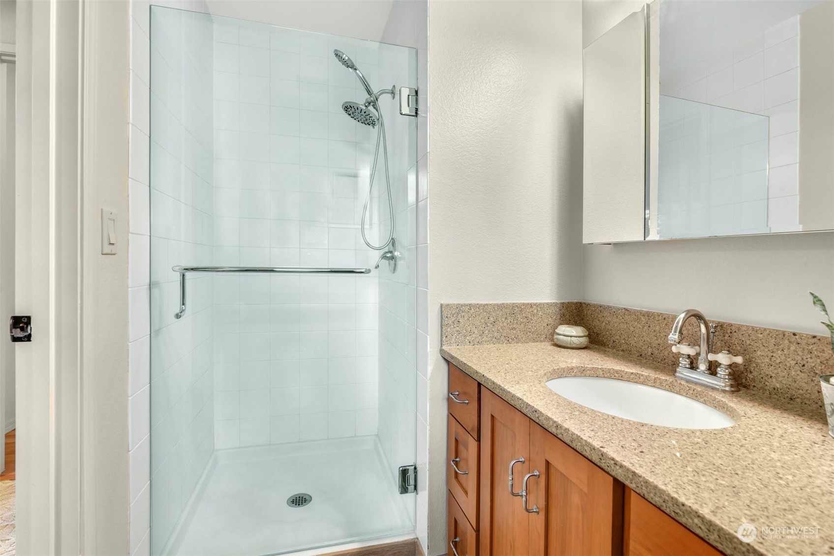 823 South 28th Court Renton, WA 98055 - Photo 17 of 37 a bathroom with a granite countertop sink and a mirror