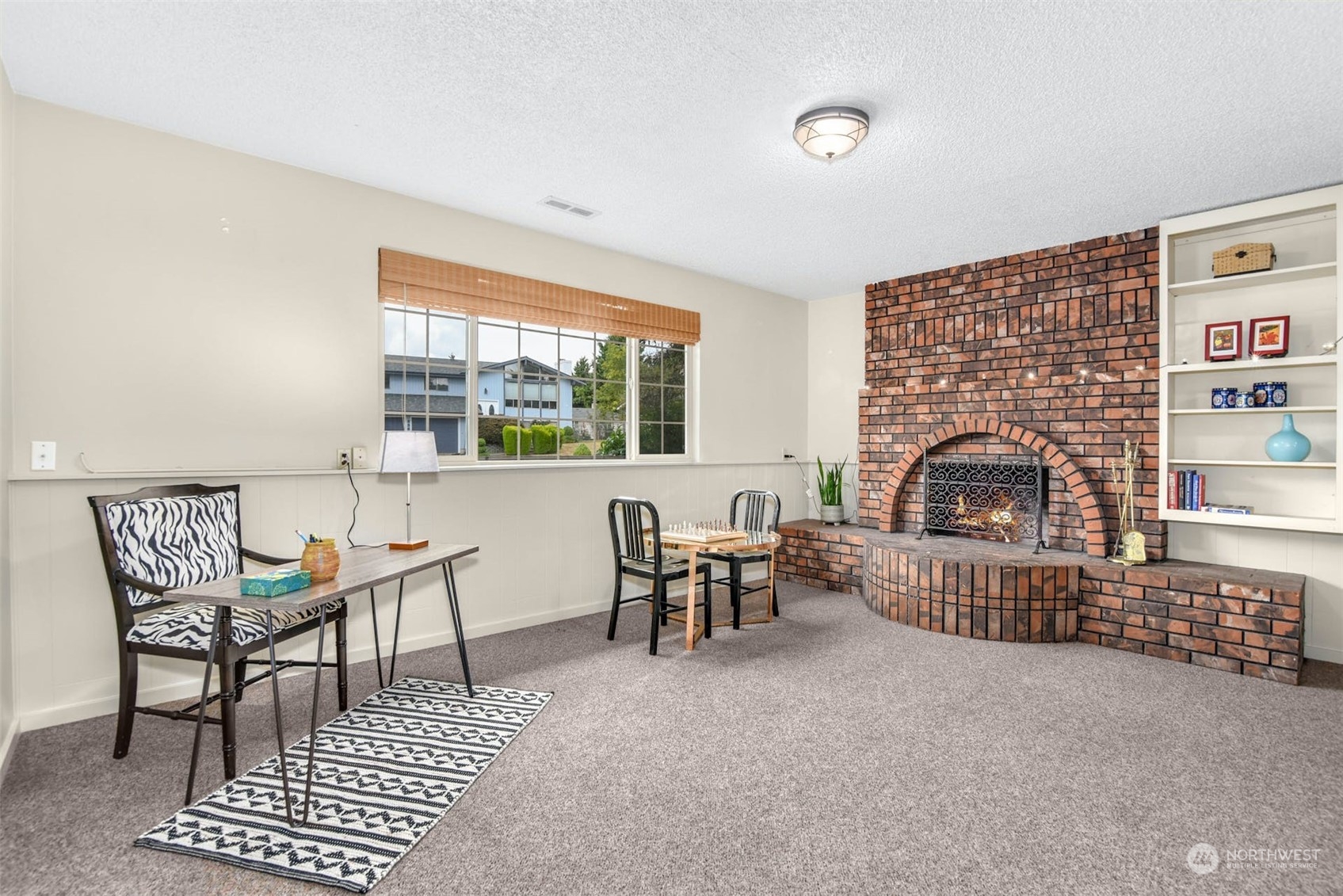 823 South 28th Court Renton, WA 98055 - Photo 18 of 37 a living room with furniture a rug and a fireplace