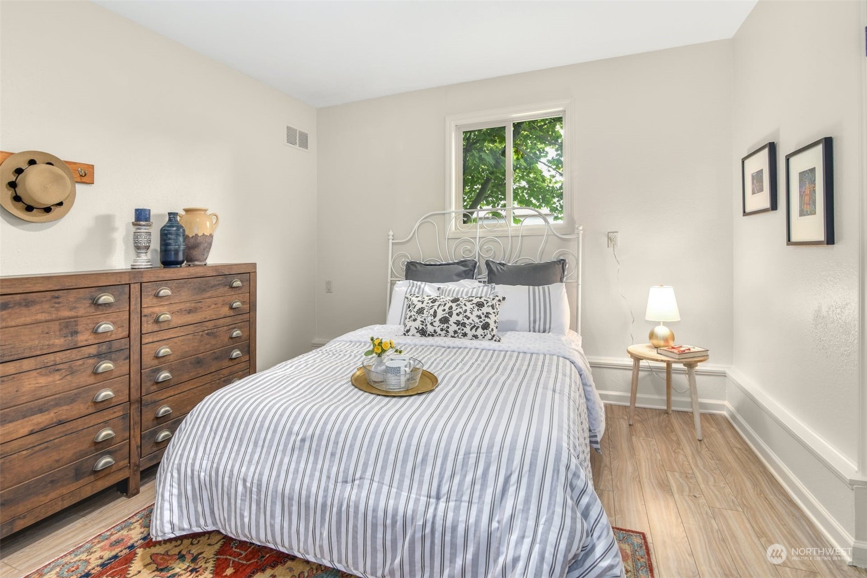 823 South 28th Court Renton, WA 98055 - Photo 24 of 37 a bedroom with a bed and wooden floor
