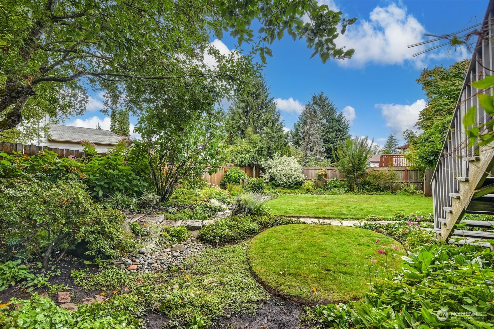 823 South 28th Court Renton, WA 98055 - Photo 30 of 37 a view of a garden with a tree
