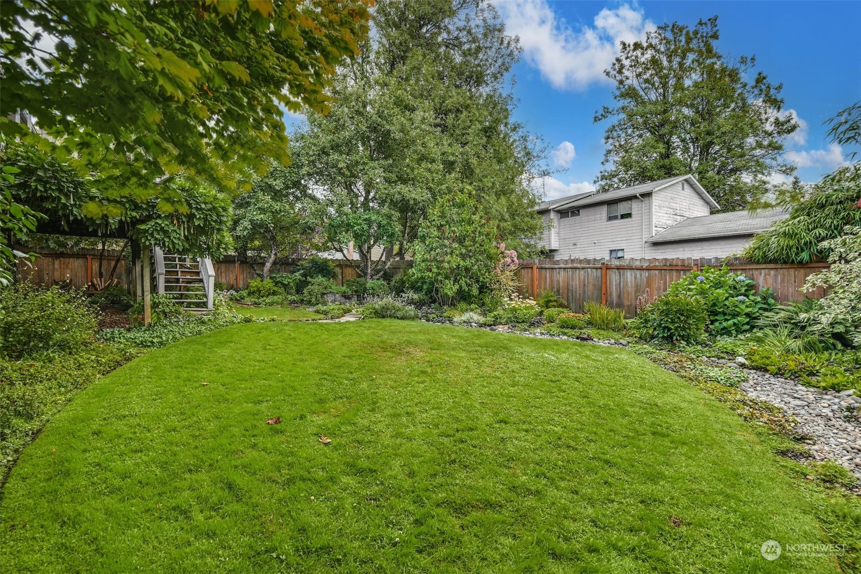 823 South 28th Court Renton, WA 98055 - Photo 33 of 37 a view of a backyard with a garden