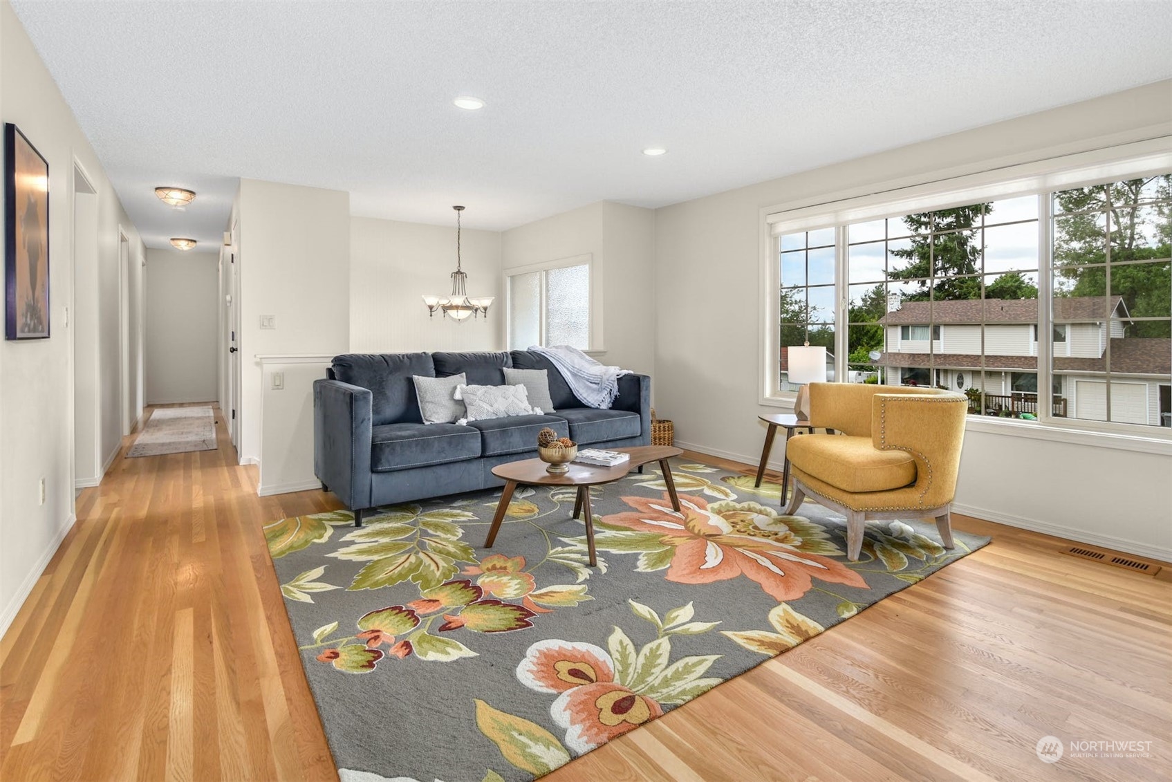 823 South 28th Court Renton, WA 98055 - Photo 5 of 37 a living room with furniture and a table