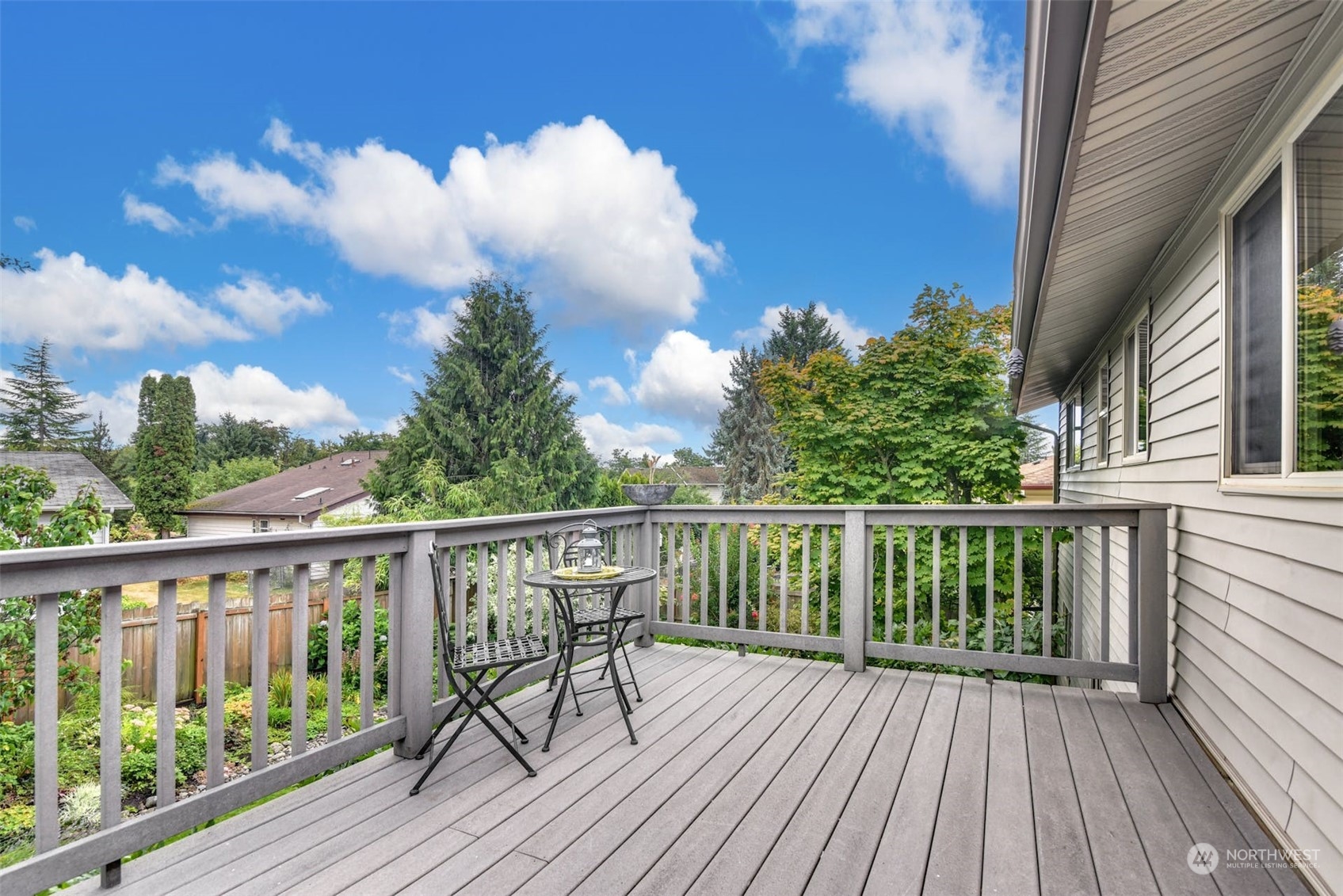 823 South 28th Court Renton, WA 98055 - Photo 7 of 37 a view of balcony with wooden floor and fence