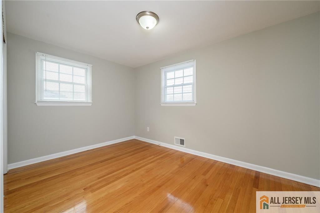 691 Inman Avenue Colonia, NJ 07067 - Photo 19 of 32 an empty room with a window