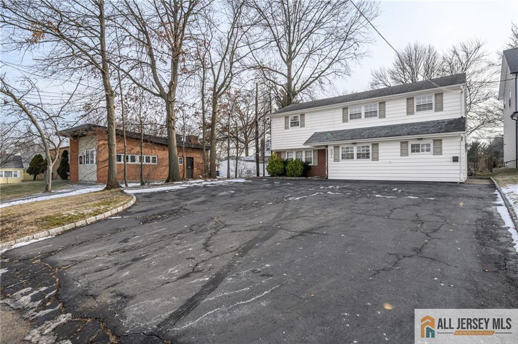 691 Inman Avenue Colonia, NJ 07067 - Photo 2 of 32 a view of house with a yard