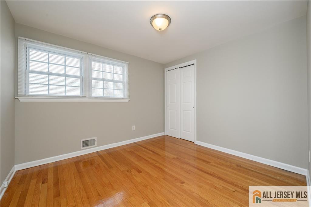 691 Inman Avenue Colonia, NJ 07067 - Photo 21 of 32 an empty room with a window