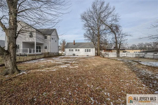 a view of house with trees in the background