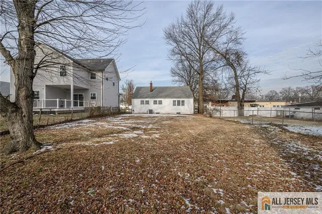 a view of house with trees in the background