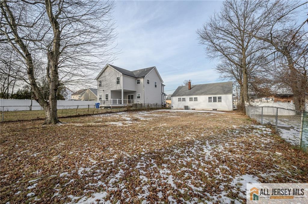 691 Inman Avenue Colonia, NJ 07067 - Photo 31 of 32 a view of house with trees in the background