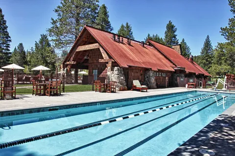a front view of house with yard and outdoor seating