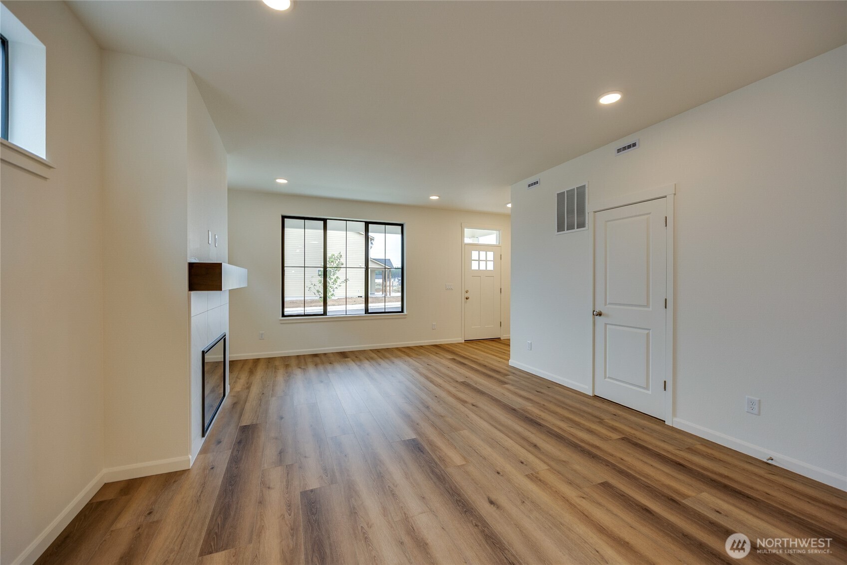 950 RW Fletcher Street Winlock, WA 98596 - Photo 13 of 40 wooden floor in an empty room with a window