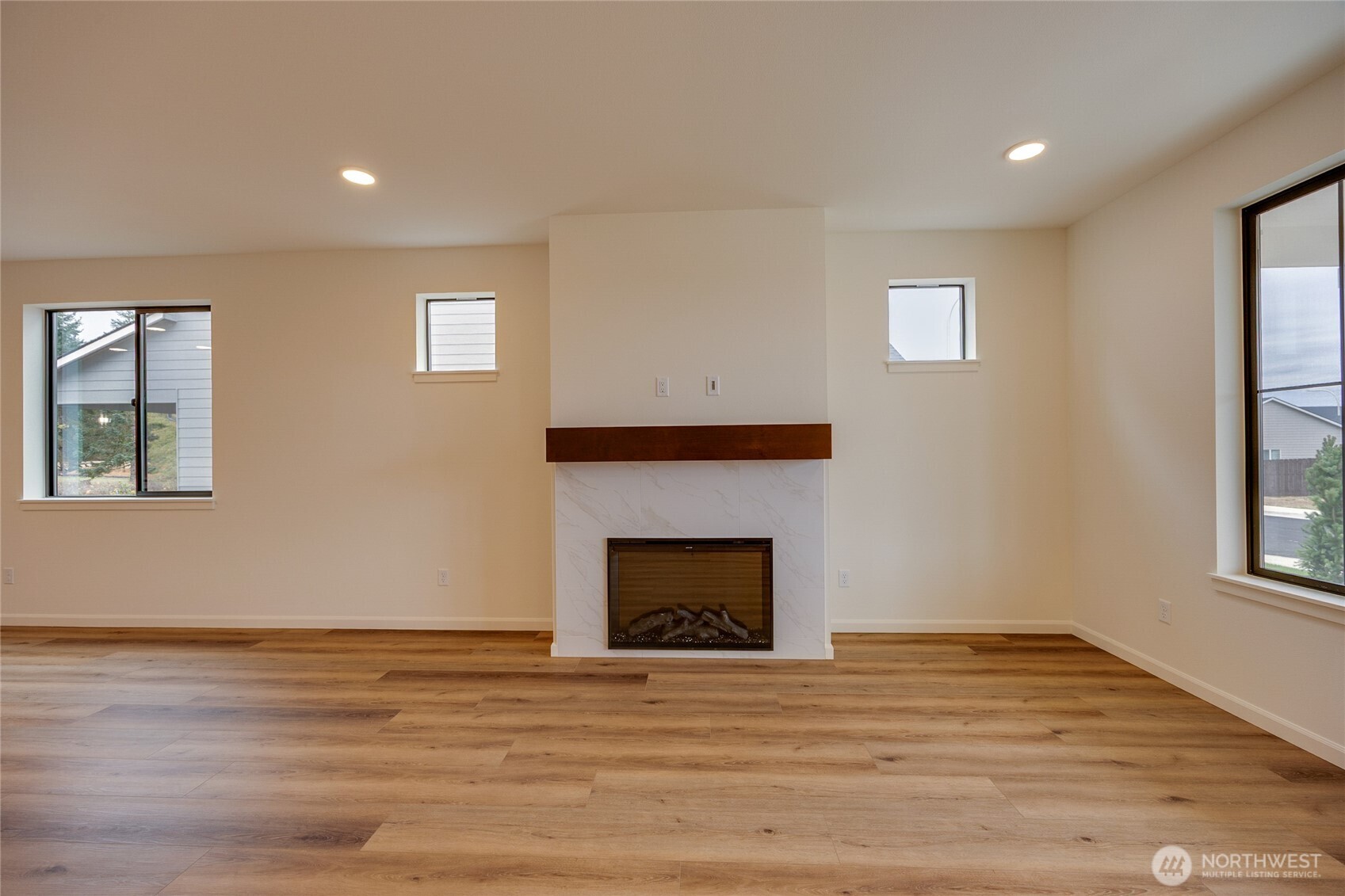 950 RW Fletcher Street Winlock, WA 98596 - Photo 18 of 40 a view of an empty room with wooden floor and a window