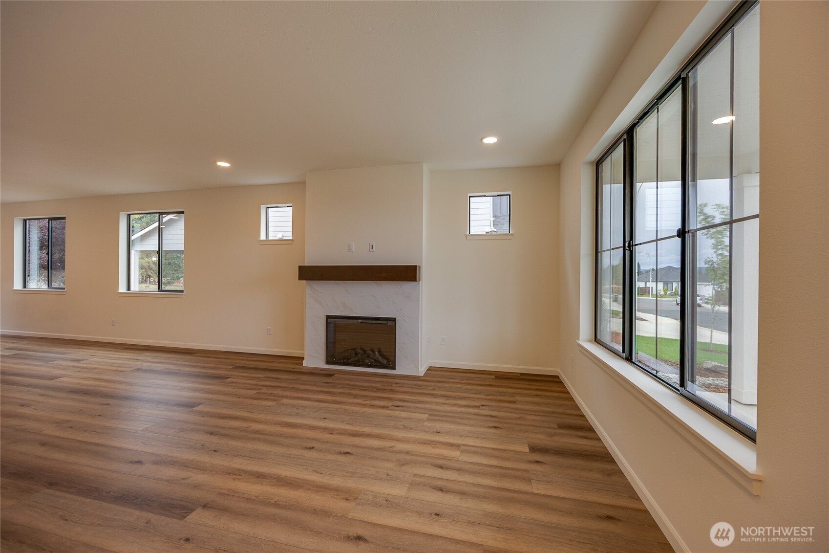 950 RW Fletcher Street Winlock, WA 98596 - Photo 19 of 40 a view of empty room with wooden floor and fireplace