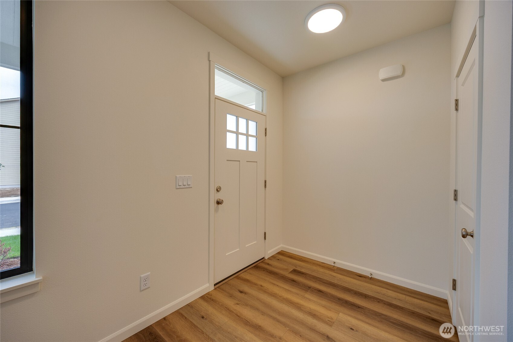 950 RW Fletcher Street Winlock, WA 98596 - Photo 5 of 40 a view of room with window and hardwood floor