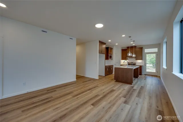 a view of kitchen and kitchen with a sink