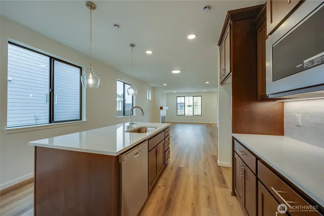 a spacious bathroom with a granite countertop sink