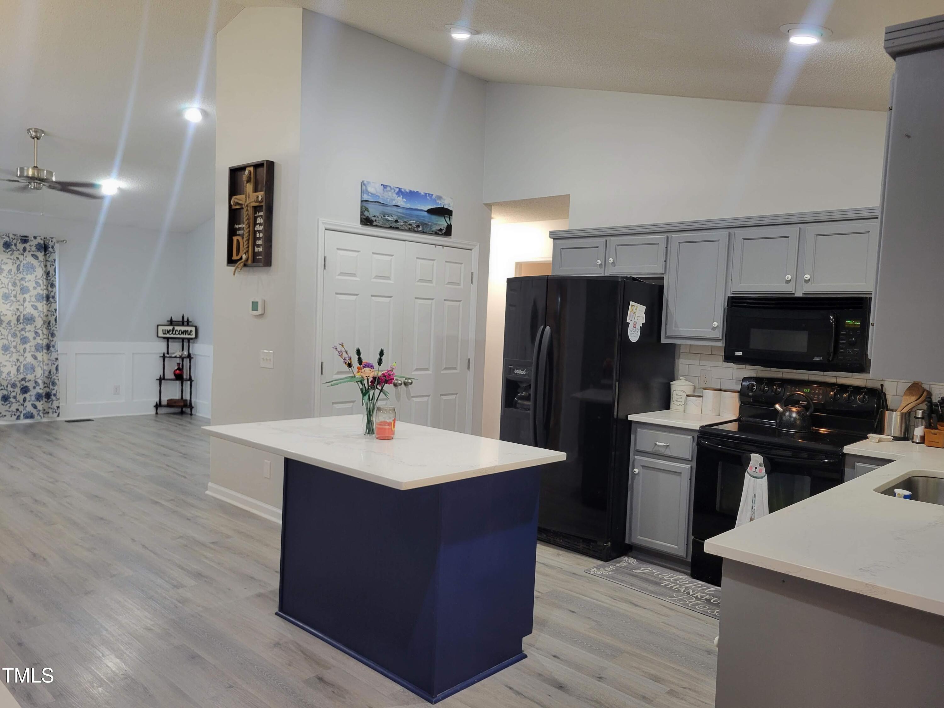 78 Phil Johnson Road Sanford, NC 27330 - Photo 15 of 47 a kitchen with stainless steel appliances a sink stove and refrigerator