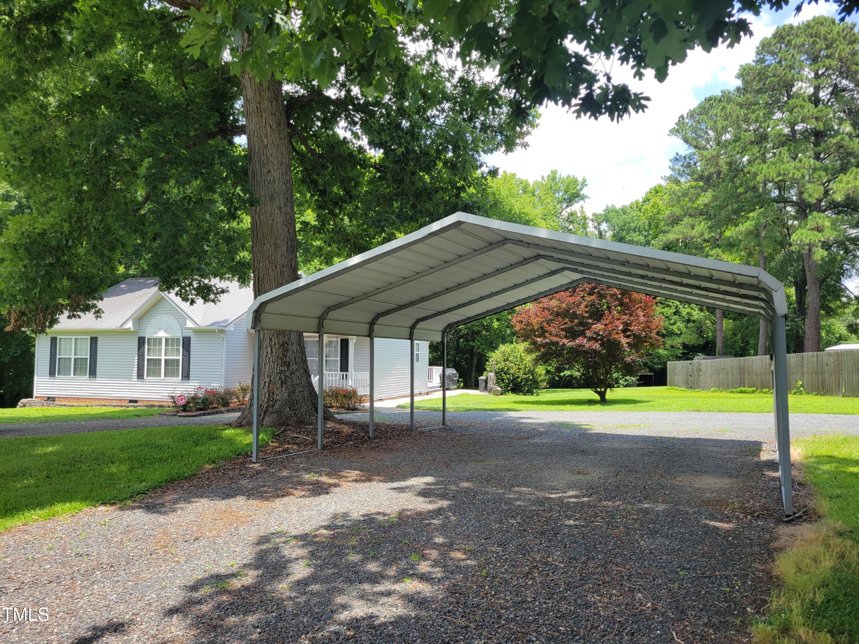 78 Phil Johnson Road Sanford, NC 27330 - Photo 3 of 47 a view of a house with a yard and tree s