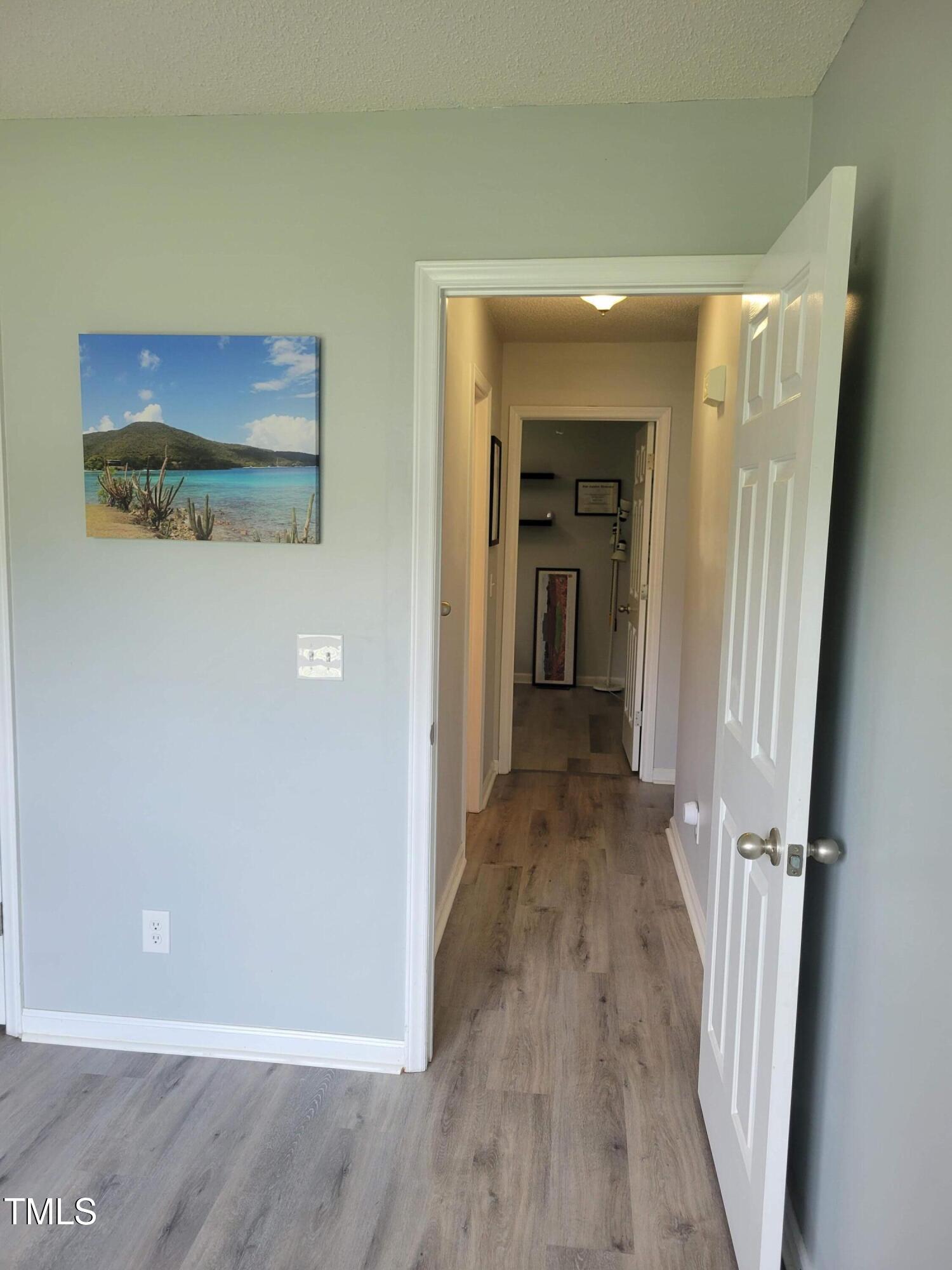 78 Phil Johnson Road Sanford, NC 27330 - Photo 38 of 47 a view of a hallway with wooden floor and staircase