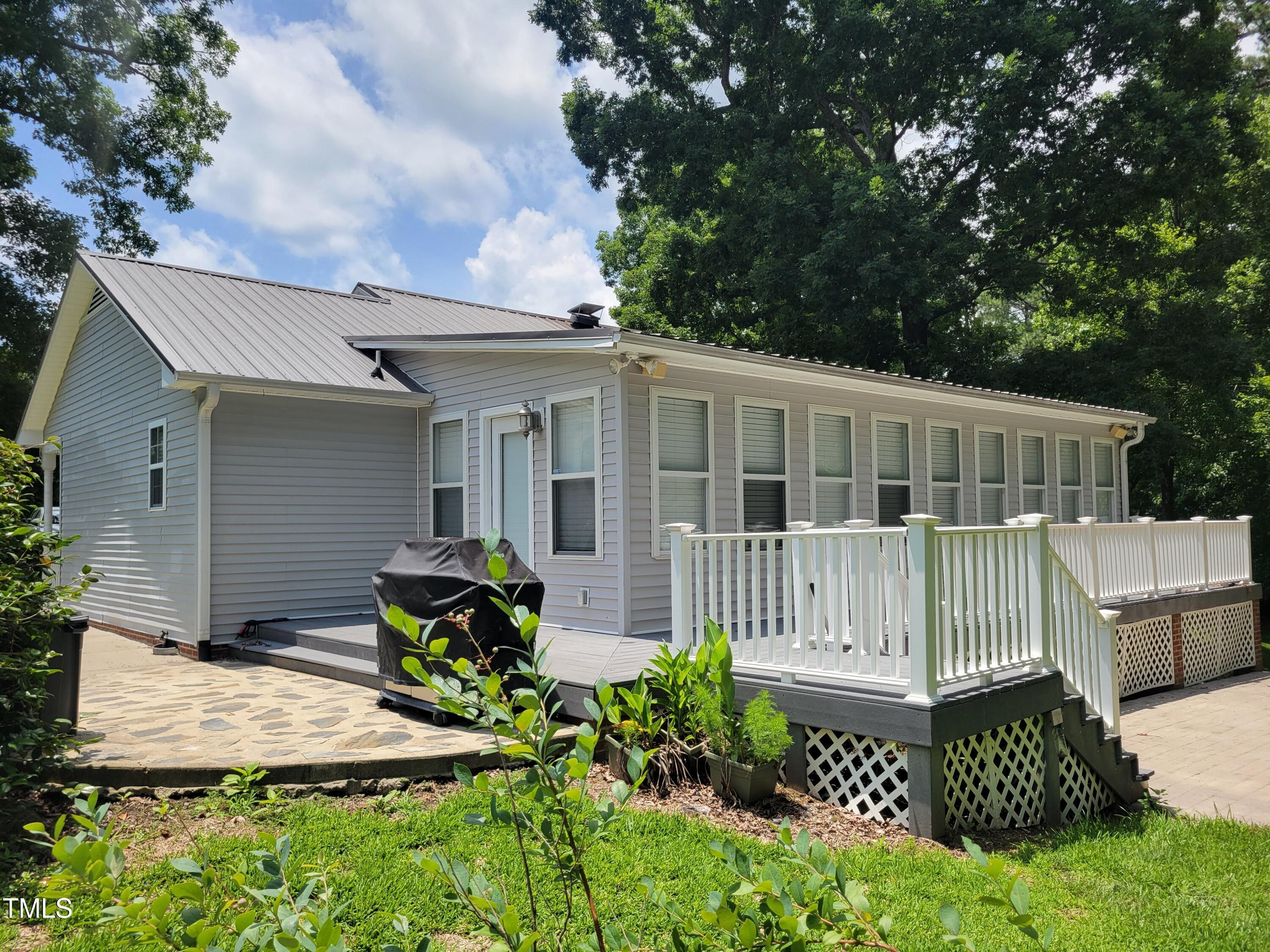78 Phil Johnson Road Sanford, NC 27330 - Photo 6 of 47 a view of a chair and table in the patio