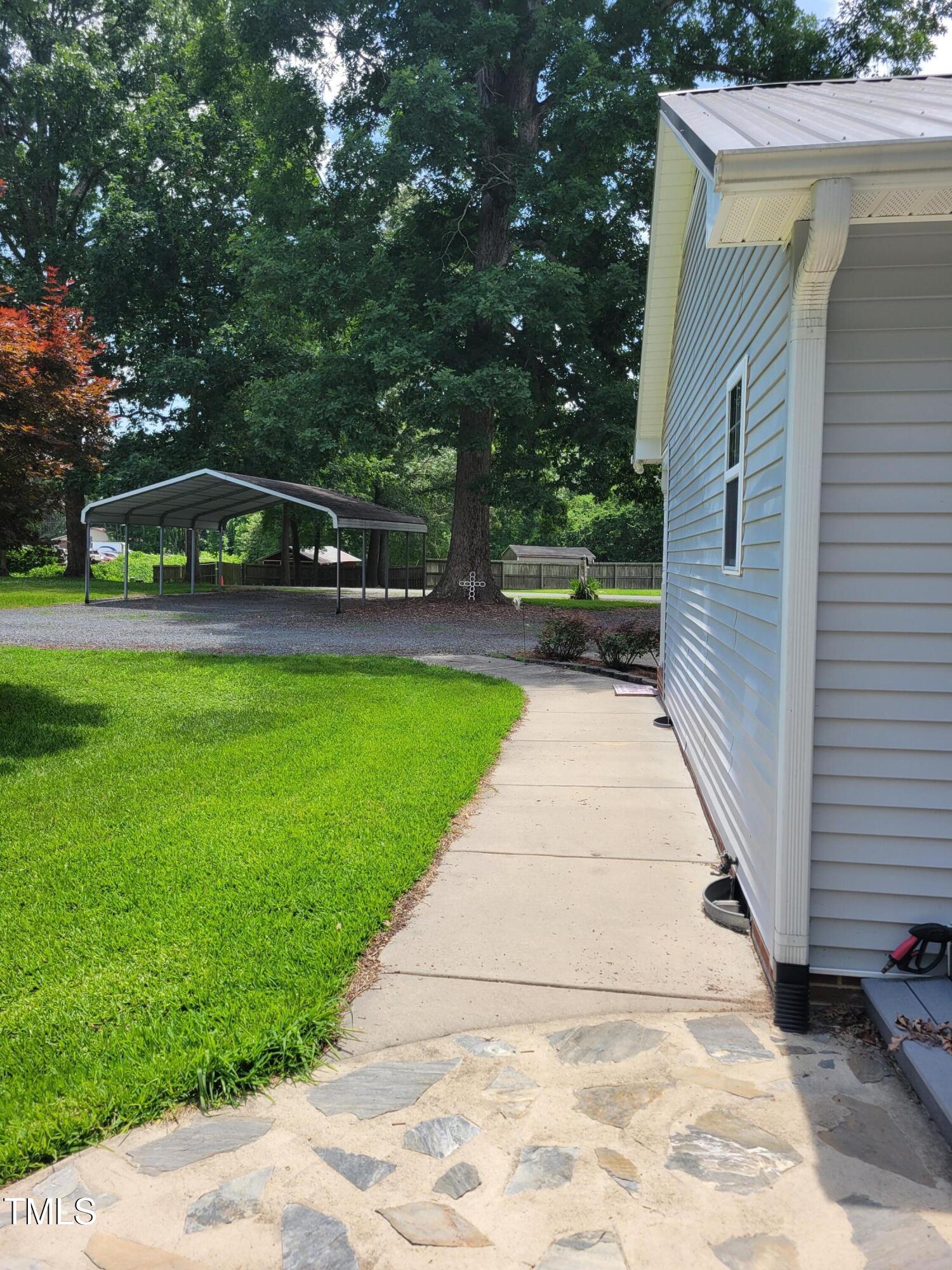 78 Phil Johnson Road Sanford, NC 27330 - Photo 8 of 47 a front view of a house with garden