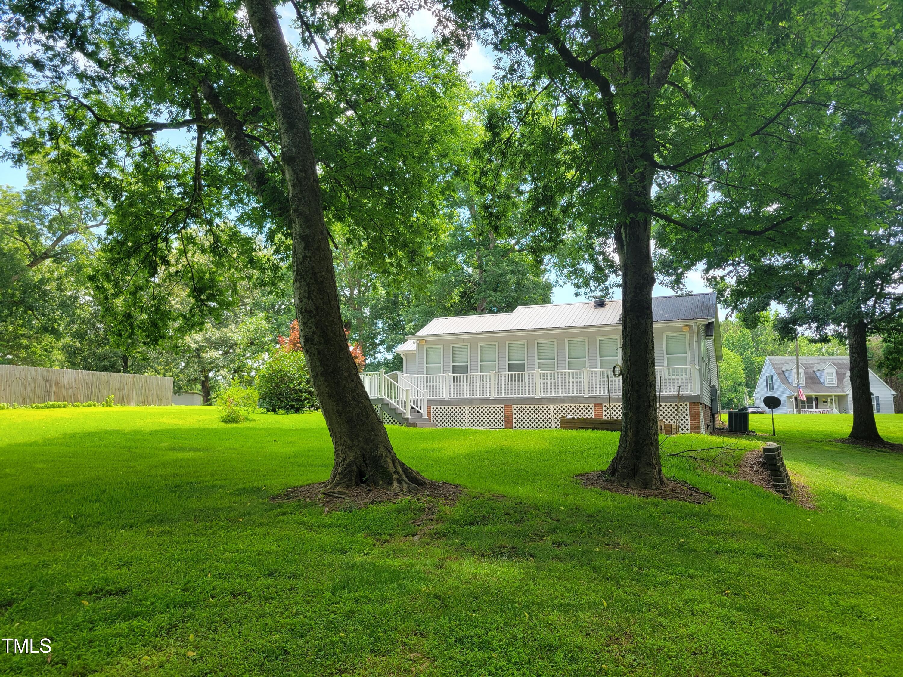 78 Phil Johnson Road Sanford, NC 27330 - Photo 9 of 47 a view of a house with a backyard