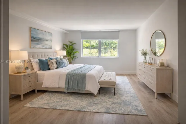 a bedroom with two beds and a window