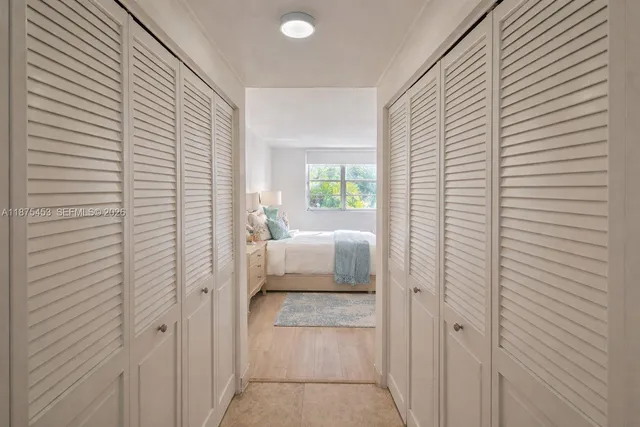 a bathroom with a sink a toilet and a large mirror