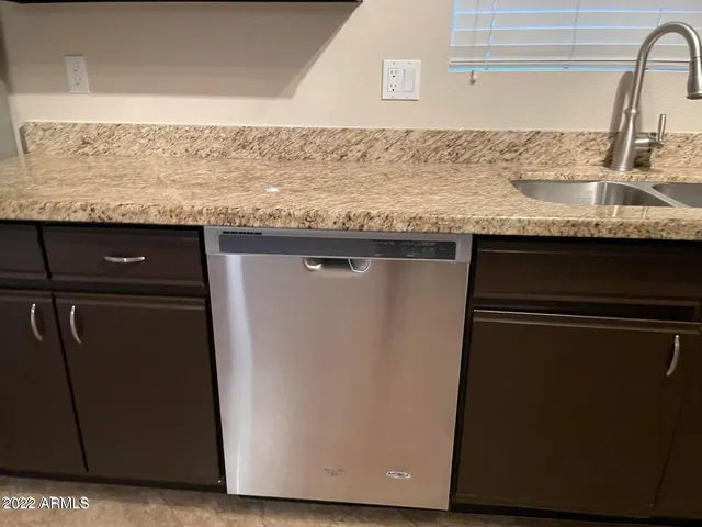 a view of an empty room with glass door
