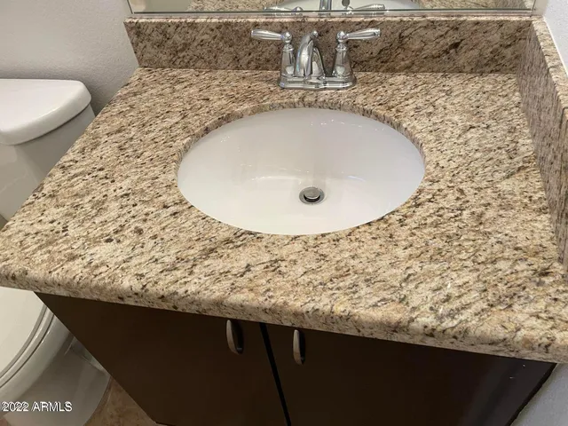 a view of a backyard with tree