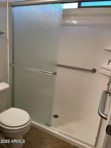 a view of a patio with couches and potted plants