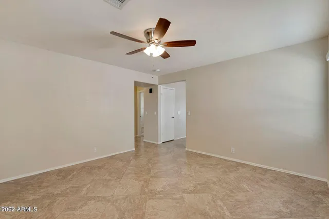 a view of an empty room with a window