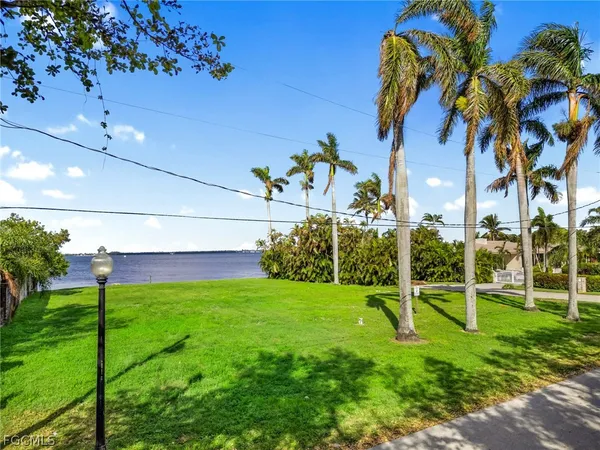 a view of yard with swimming pool and green space