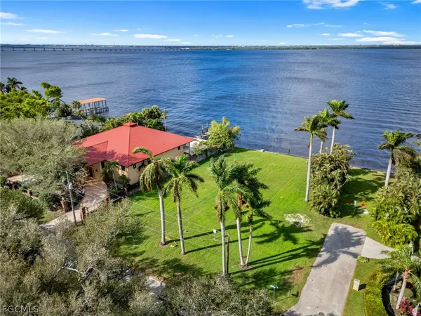 a aerial view of a house with a yard