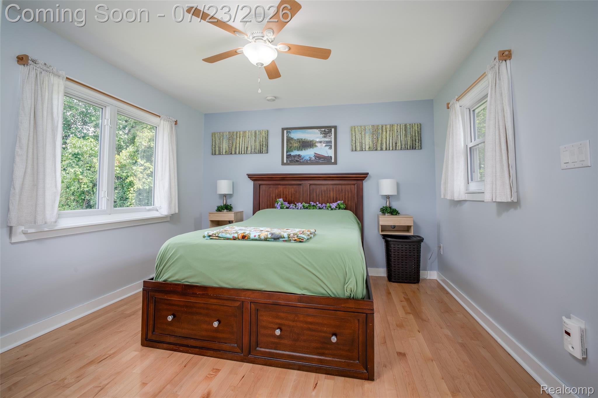 829 Francis Street Rochester, MI 48307 - Photo 13 of 25 Light wood-finish flooring complements soft blue walls